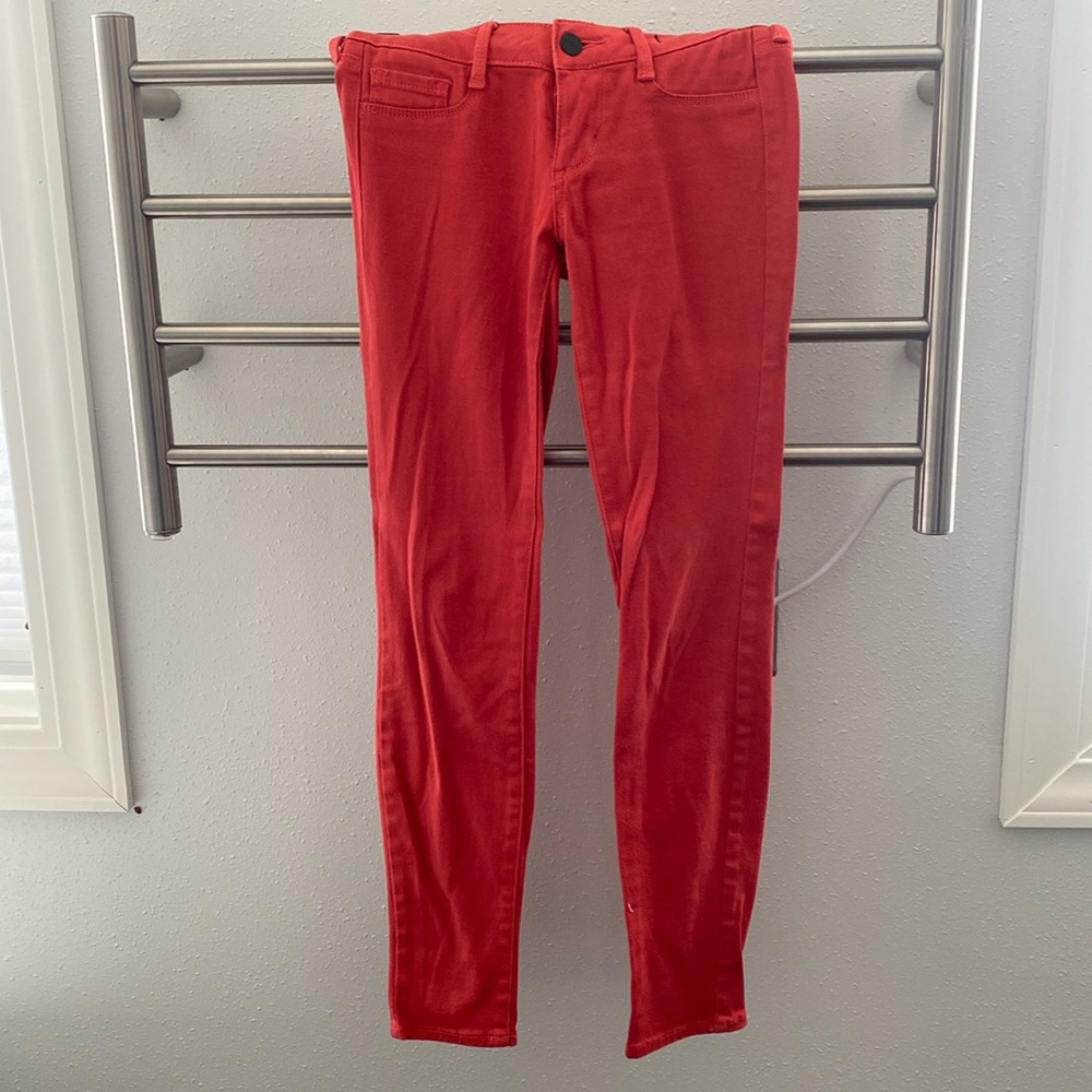 Burnt orange bullheads black denim leggings